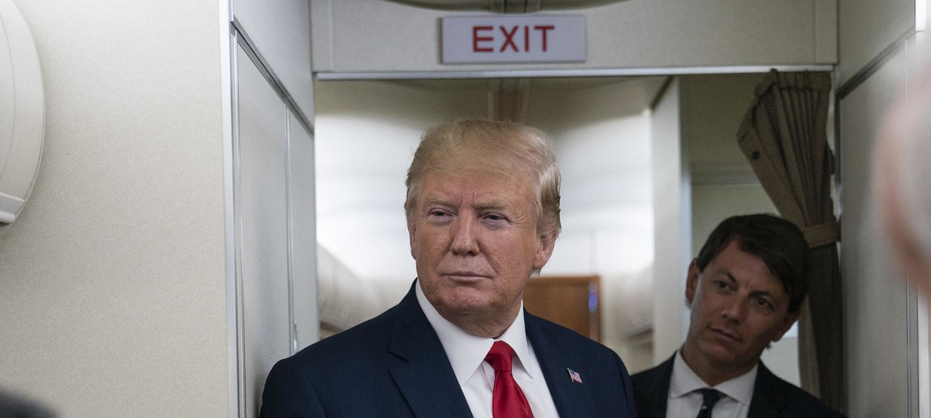 Donald Trump with sign Exit